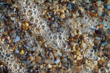 sea pebbles colored granite on the beach