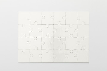 top view of completed jigsaw puzzle on white background