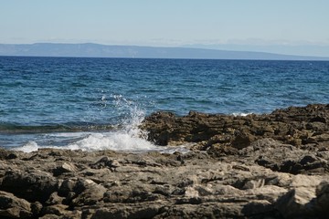 waves crashing on rocks