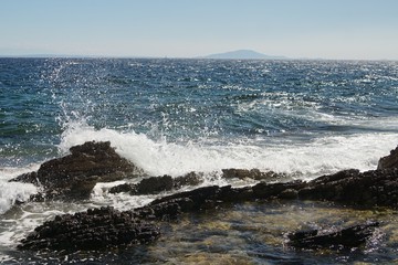 waves crashing on rocks