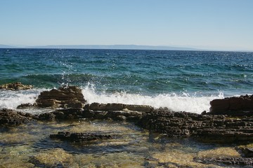 waves crashing on rocks