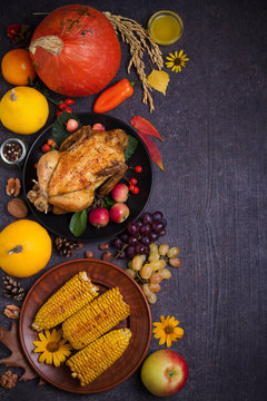 Chicken or turkey, autumn fruits and vegetables. Thanksgiving food concept. Harvest or Thanksgiving background. Flat lay, copy space, vertical image