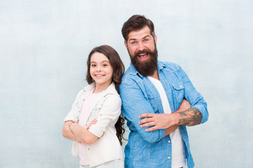 My dad is always there. Happy dad and adorable little daughter smiling on grey background. Bearded dad and small girl child wearing smiling in casual style. My dad is my love