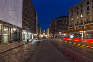 Piazza Cordusio at dusk, the Sforza Castle in the background, in the foreground light trail left by the passing tram