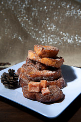 White plate with french toast, sliced bread, sweet. Dark background .Christmas jelly.Breakfast.View from above. From above.Light background, defocused silver sparkle.Vertical.