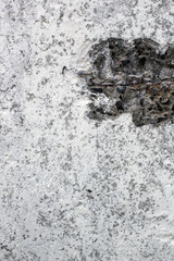 Background of old shabby white plastered wall