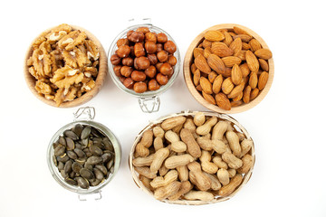 Nuts in bowls on a white background