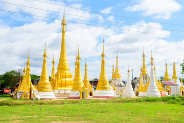 golden pagodas at inle lake, myanmar