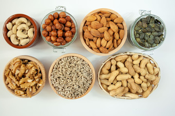 Nuts in bowls on a white background