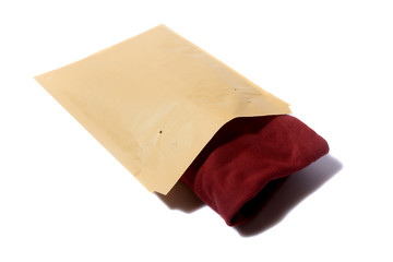 red jumper packed in yellow bubble envelope