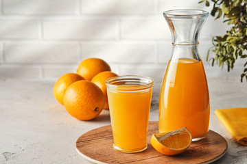 Obraz na płótnie Canvas Fresh Squeezed Orange Juice with Fresh Fruits.