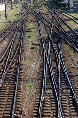 Fototapeta na wymiar crossing railroad tracks vertical perspective industrial logistics ans passenger transport delivery