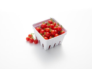A pint, 550ml, of freshly picked cherry tomatoes on white