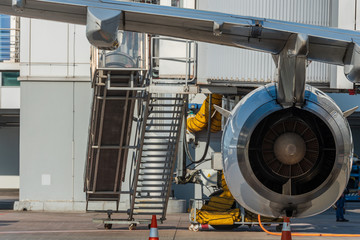 Aircraft jet engine detail in the exposition. Turbine Engine Profile. Aviation Technologies. Airport background