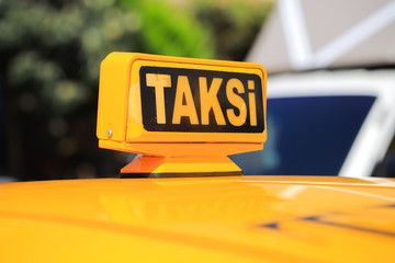 Yellow taxi car roof sign