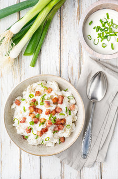 Bryndzove Halusky, national dish in Slovakia, potato dumplings with sheep cheese and sour cream, topped with roasted bacon pieces and spring onion