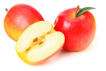 red apples with slices and green leaves isolated on a white background