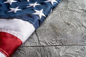 American or USA flag on concrete background with copy space for text