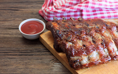 grilled pork ribs on a cutting board