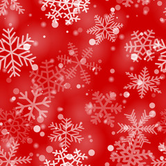 Christmas seamless pattern of snowflakes of different shapes, sizes and transparency in red colors