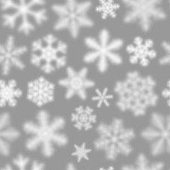 Naklejka na ściany i meble Christmas seamless pattern of white defocused snowflakes on gray background