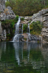 Naklejka na ściany i meble Waterfall at a natural spot called Poço Negro in Carvalhais, Sao Pedro do Sul, Portugal