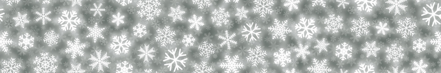 Fototapeta na wymiar Christmas horizontal seamless banner of white snowflakes on gray background