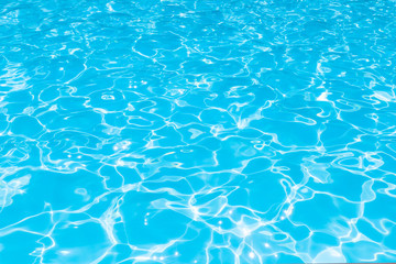 Blue water transparent and ripple wave in swimming pool, Beautiful water surface in pool with bright sunny reflection for background, Turqoise sea water surface and ripple