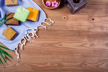 many colorful soap over wooden table 