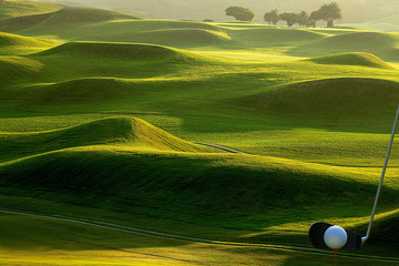 Collection of golf equipment resting with nice golf place