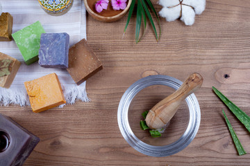many colorful soap over wooden table 
