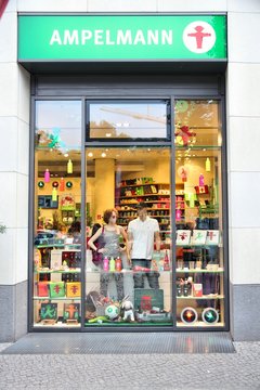 BERLIN, GERMANY - AUGUST 25, 2014: People visit Ampelmann souvenir store in Berlin. Ampelmann is the pedestrian light symbol in Berlin. It was conceived in 1961.