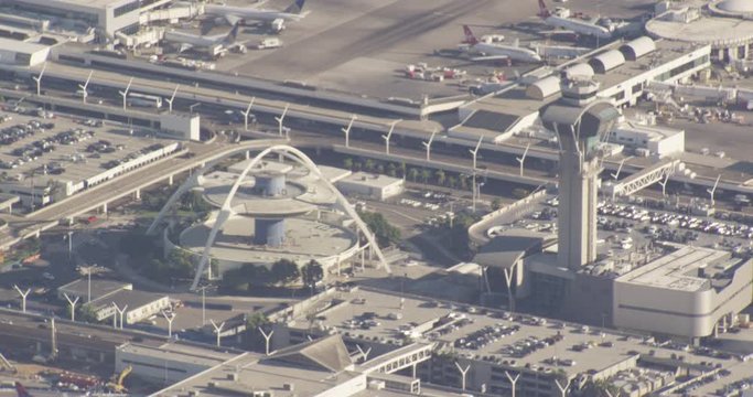 Aerial shot, day, extreme zoom in of LAX, zoom out to show airport, drone