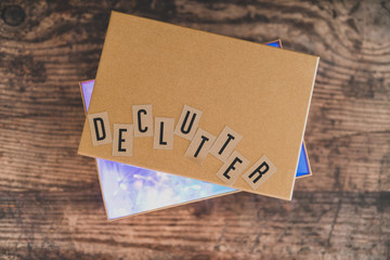 declutter message on top of semi-open box to fill with items to give away (version with lights shining from inside the box)