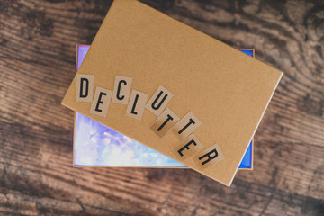 declutter message on top of semi-open box to fill with items to give away (version with lights shining from inside the box)