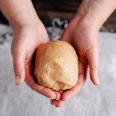 Christmas and New Year celebration traditions. Family home bakery, cooking traditional festive sweets. Woman making aromatic spicy gingerbread dough