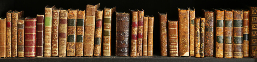 old books on wooden shelf