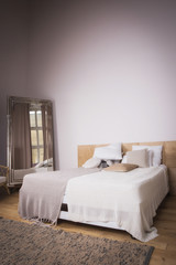 Interior of the beautiful bedroom with a vintage bed