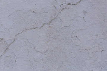 Texture of the old concrete wall with scratches, cracks, dust, crevices, roughness, stucco. Can be used as a poster or background for design. 