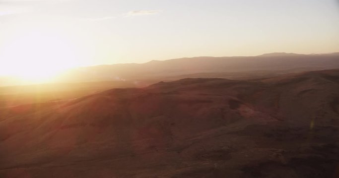 Aerial shot, day, sunset over arid california hill country, drone