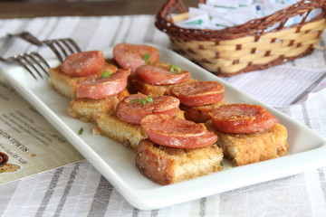 Snacks of bread with sausage