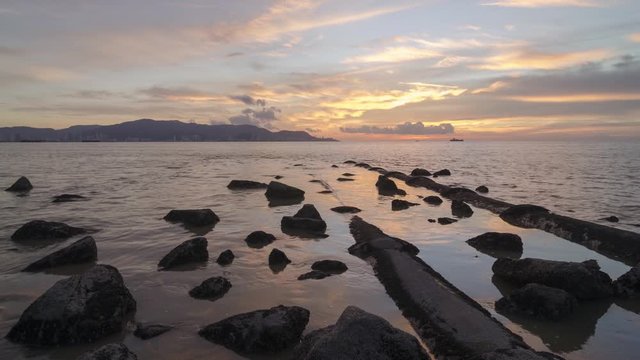 Timelapse beautiful sunset at picturesque scenery of rocky stone Taman Robina. Shoot transition  from day to night with