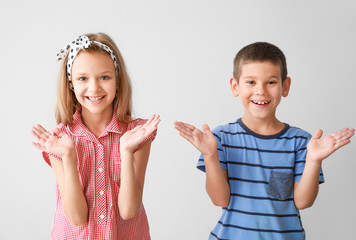 Portrait of happy children on light background