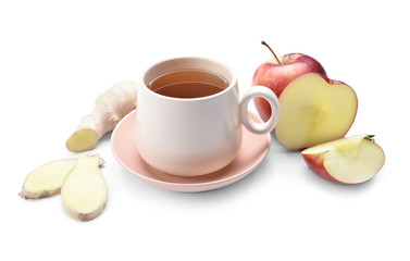 Cup of hot tea with apple and ginger on white background