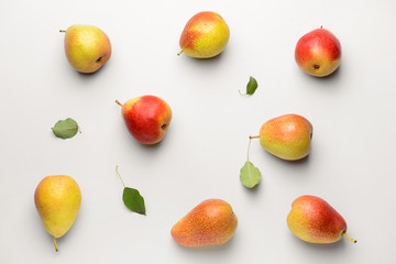 Sweet ripe pears on white background