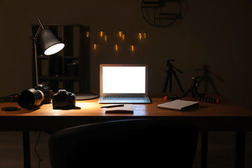 Workplace of photographer late in evening