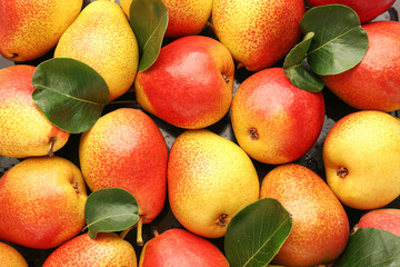 Many sweet ripe pears as background
