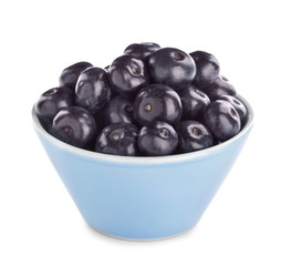 Bowl with fresh acai berries on white background