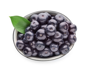 Bowl with fresh acai berries on white background