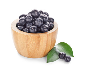 Bowl with fresh acai berries on white background
